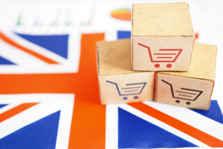 Online shopping, Shopping cart box on United Kingdom flag, import export, finance commerce.の写真素材
