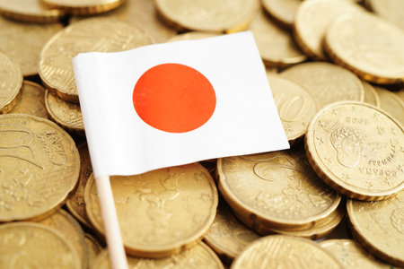 Japan flag on coin and banknote money, finance trading investment business currency concept.の写真素材