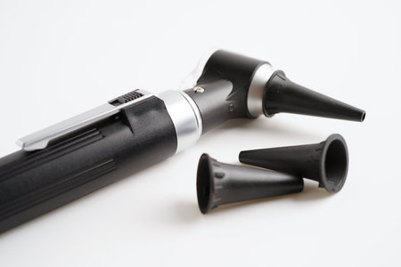 Otoscope isolated on white background for otolaryngologist or ENT physician doctor examining senior patient ear, hearing loss problem.の写真素材