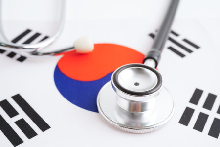 South Korea flag with black stethoscope, Business and finance concept.の写真素材