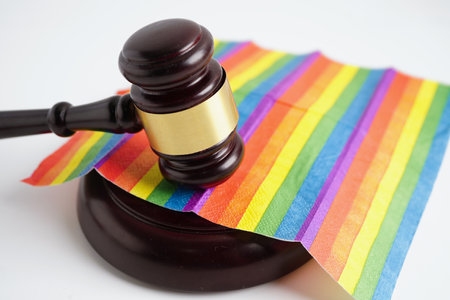 Gavel for judge lawyer on rainbow flag, symbol of LGBT pride month.の写真素材