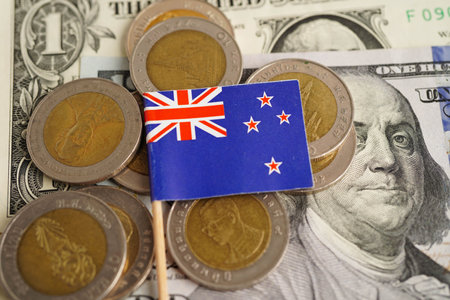 Australia flag on coins background, finance and accounting, banking concept.の写真素材