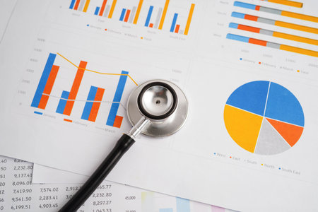 Stethoscope on chart or graph paper, Financial, account, statistics and business data medical health.の写真素材