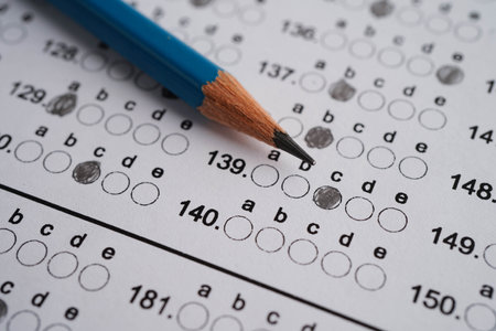 Answer sheets with pencil drawing fill to select choice, education concept.の写真素材