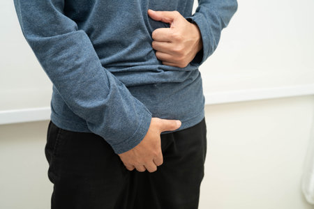 Hernia, Asian man stomach ache, abdominal pain and urology problem health.