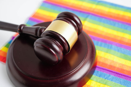 Gavel for judge lawyer on rainbow flag, symbol of LGBT pride month.の写真素材
