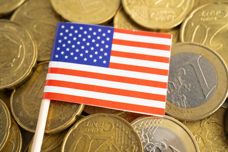 USA American flag on coins background, finance and accounting, banking concept.の写真素材