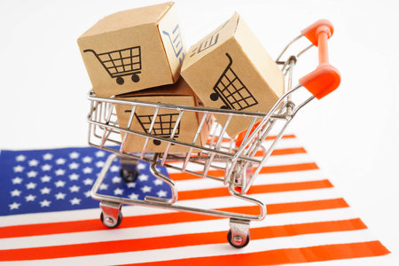 Online shopping, Shopping cart box on US America flag, import export, finance commerce.の写真素材