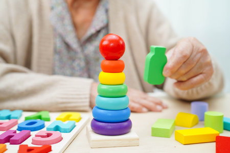 Asian elderly woman playing game.の写真素材