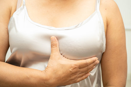 Asian woman self touching check lump or Breast cancer, Breast Self Exam.の写真素材