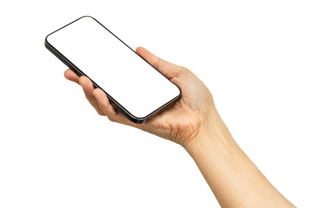 Woman holding smartphone in hand with blank screen isolated on white background with clipping path.の写真素材