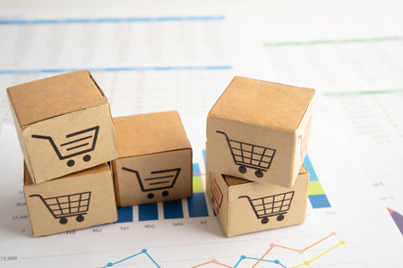 Online shopping, Shopping cart box on business graph, import export, finance commerce.の写真素材