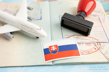 Slovakia flag and passport with airplane for travel.の写真素材