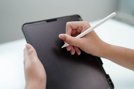 Teenage using tablet for communication, search data internet website to learn.