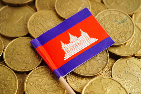 Cambodia flag on coin and banknote money, finance trading investment business currency.の写真素材