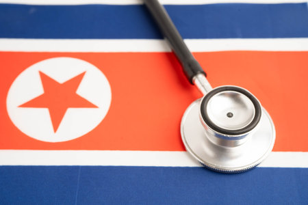 North Korea flag with black stethoscope, Business and finance concept.の写真素材