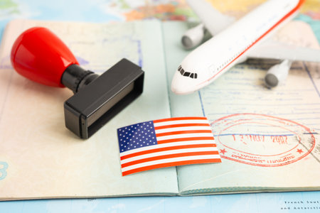 US flag and passport with airplane for travel.