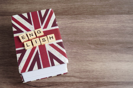 English book with graduate hat, learning and tutorial.