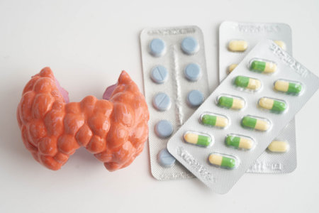 Thyroid model with pill drug treatment, Hyperthyroidism, Overactive or Lymphoma.の写真素材
