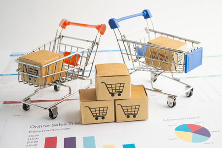Online shopping, Shopping cart box on business graph, import export, finance commerce.の写真素材