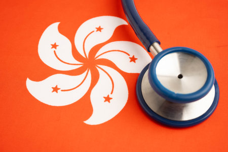 Hong Kong flag with black stethoscope.の写真素材