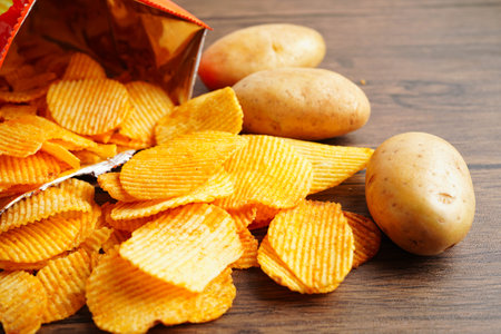 Potato chips , delicious BBQ seasoning spicy for crips, thin slice deep fried snack fast food.の写真素材
