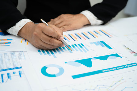 Asian business woman working with financial graph.の写真素材