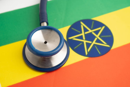 Ethiopia flag with black stethoscope, Business and finance concept.の写真素材