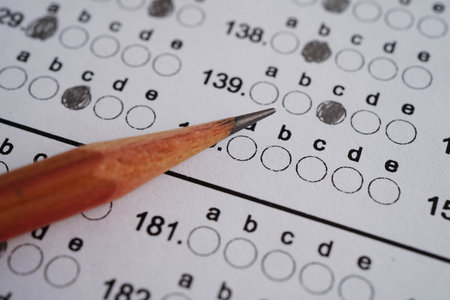 Answer sheets with pencil drawing fill to select choice, education concept.の写真素材