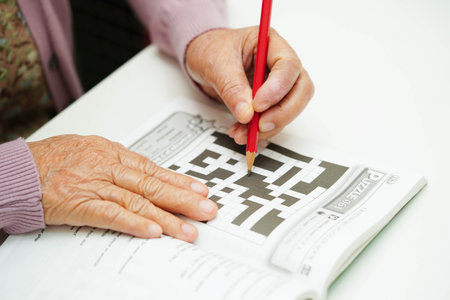 Bangkok, Thailand - May 15, 2022 elderly woman playing sudoku puzzle game.のeditorial素材