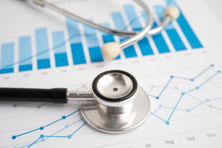 Stethoscope on chart or graph paper, Financial, account, statistics and business data medical health.の写真素材