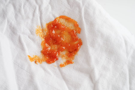 Dirty tomato sauce stain or ketchup on cloth to wash with washing powder, cleaning housework.