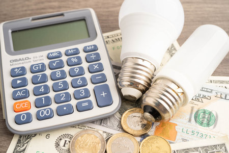 Bangkok, Thailand April 7, 2025 Cost of electric utilities with light bulb for payment.