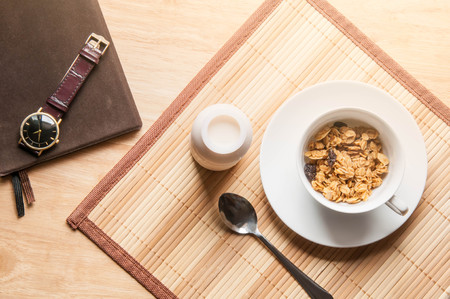 cereal and milk on wooden table breakfast in the morningの写真素材