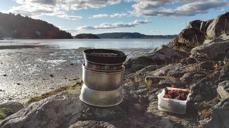 Close up view of outdoor kitchen on cliff, sea and forest backgroundの写真素材