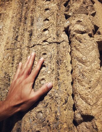 Hand Touching Wall of Caravansari in Turkey, Close Upの写真素材