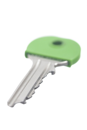 One green house key, white background.の写真素材