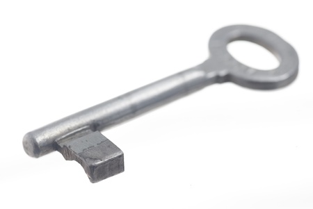 One old house key, white background.の写真素材