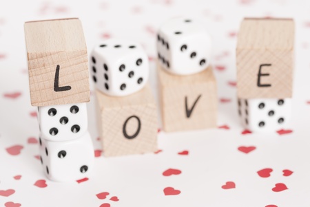 The word love alongside white dice の写真素材