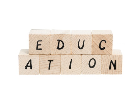 Education spelled out with wooden blocks. White background.の写真素材