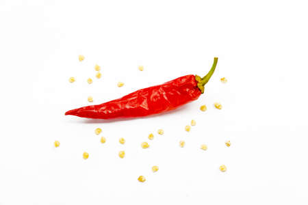 red chili pepper on a white background with seeds