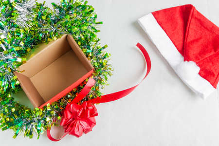 Blank gift wrapping, Santa Claus hat. Christmas and New Year concept. Flat lay.