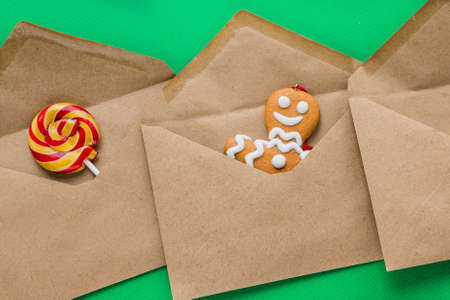 The brown envelopes contain a gingerbread man and a lollipop as a gift for Christmas and New Year....