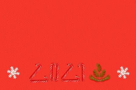 Christmas background with place for text. Snowflakes, fir branches, candy canes on a red background....
