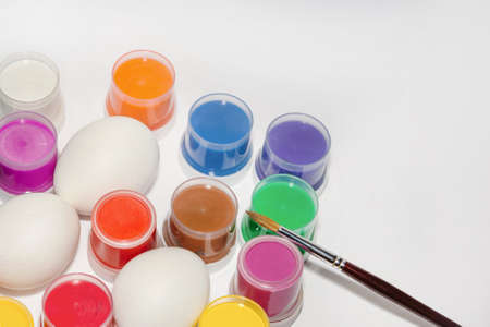 Staining fresh white eggs before Easter. Holiday preparation concept.の写真素材