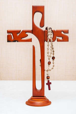 Krasnoyarsk, Russia - February 14, 2021: Catholic cross and Holy rosary. Catholic attributes.のeditorial素材