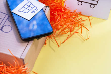 Ordering goods from a smartphone screen. Online shopping. Delivery of orders to the client.の写真素材