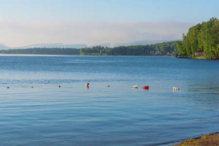 Early morning on the lake. Beautiful summer landscape.の写真素材