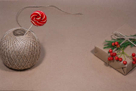 Gift wrapped in craft paper for Christmas and New Year. Holiday gift wrapping concept.の写真素材