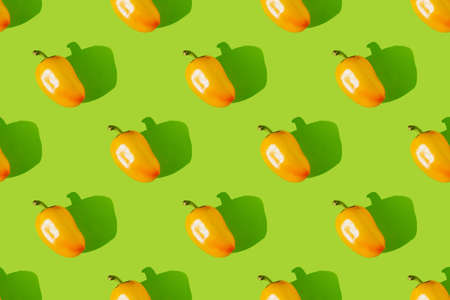 Bell pepper on a green background. Paprika seamless pattern.の写真素材
